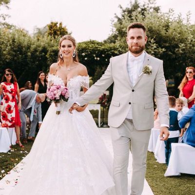 Veronika Rajek and Viktor Rajek were photographed on their wedding day.